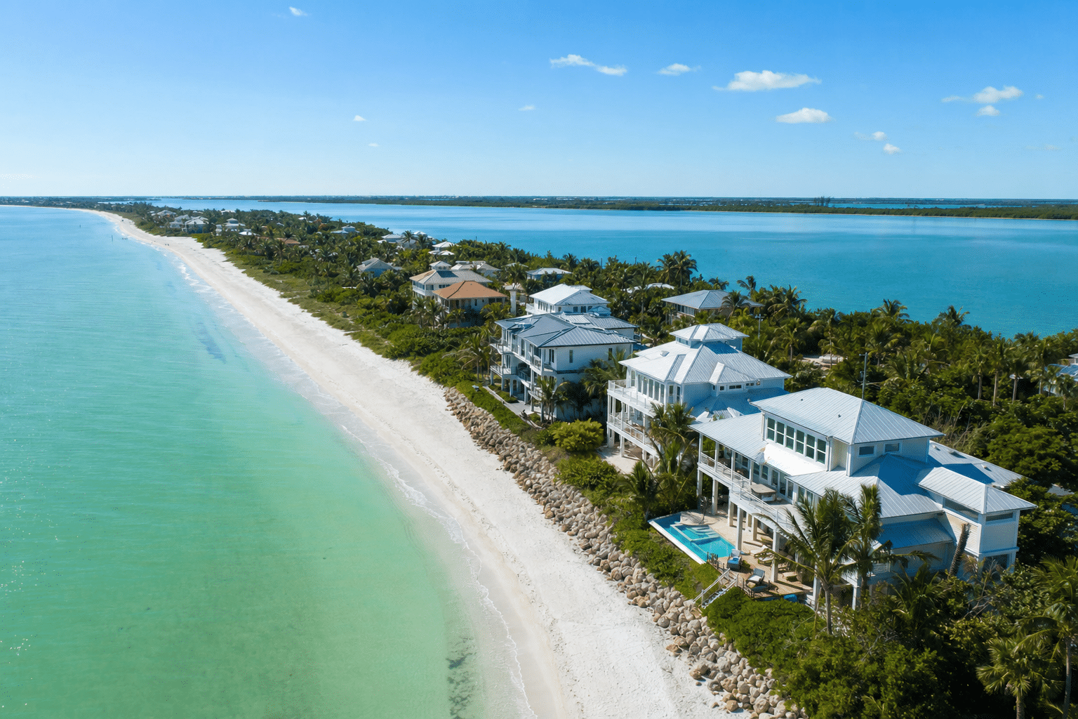 Sunny aerial of gulf coast barrier island homes